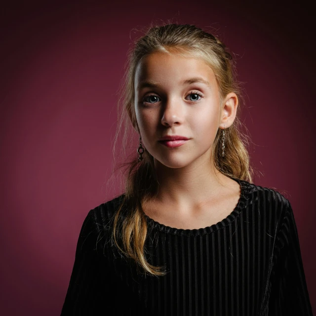 a young girl is posing for a picture, by Jesper Knudsen, pexels contest winner, realism, plain background, dramatic lighting; 4k 8k, portrait cute-fine-face, 15081959 21121991 01012000 4k