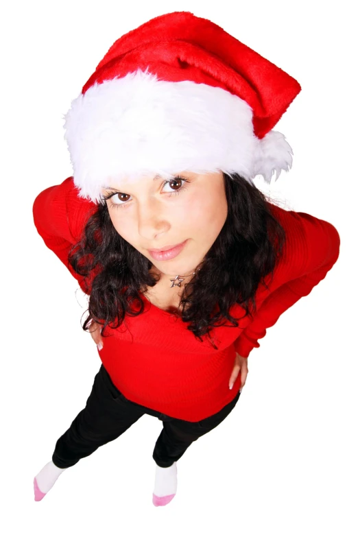 a close up of a person wearing a santa hat, hands on hips, looking down from above, brunette, digital photo