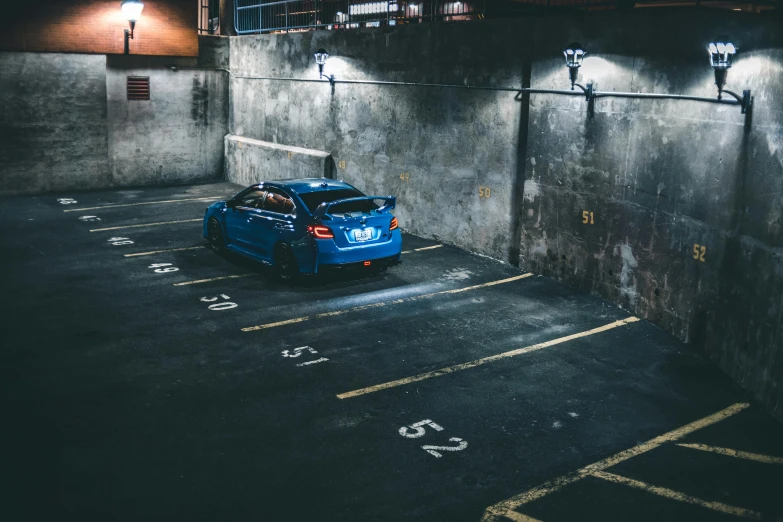 a blue car parked in a parking lot at night, pexels contest winner, in an underground parking garage, wrx golf, avatar image, square