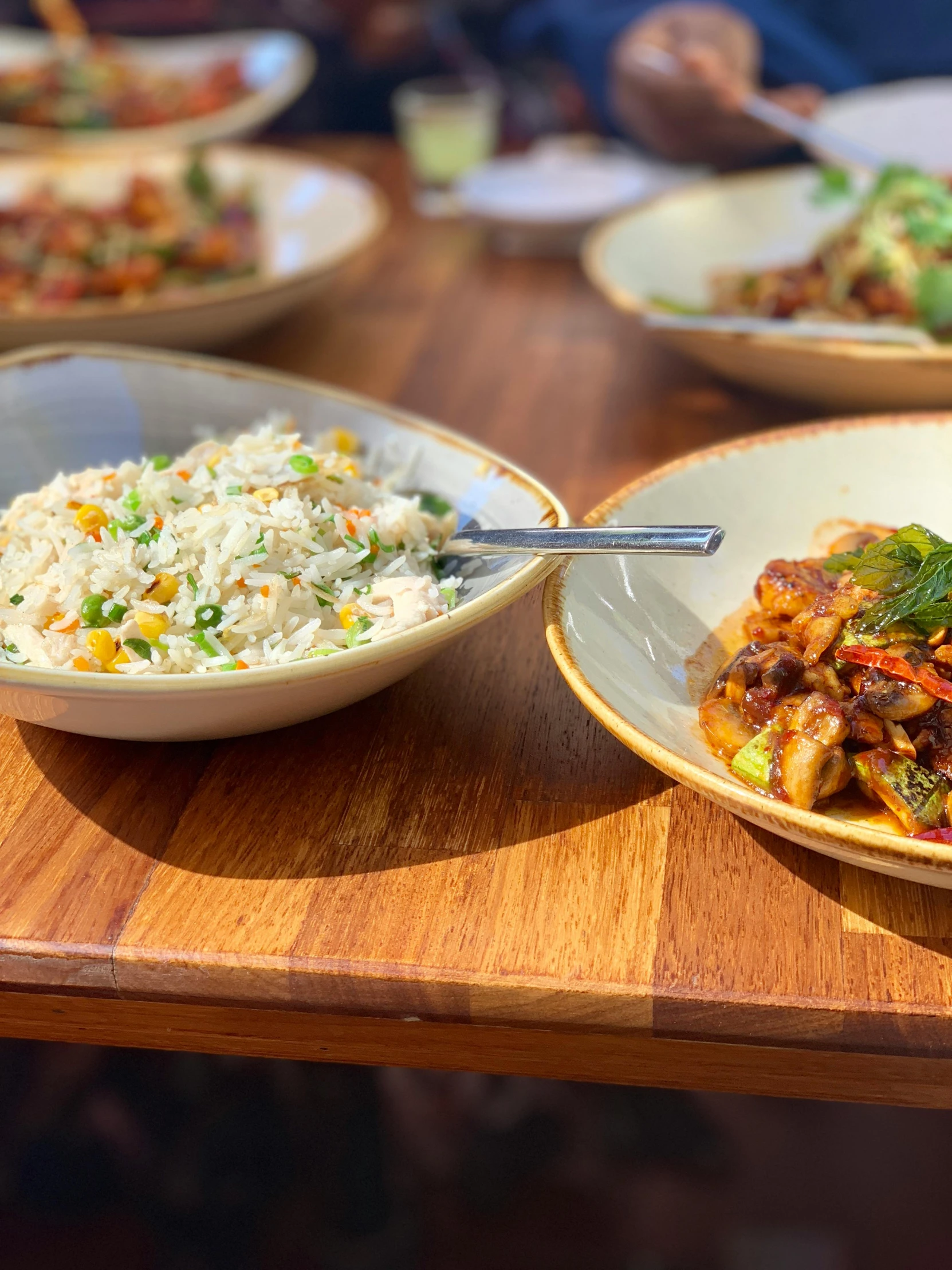 a wooden table topped with plates of food, profile image, rice, thumbnail, wok