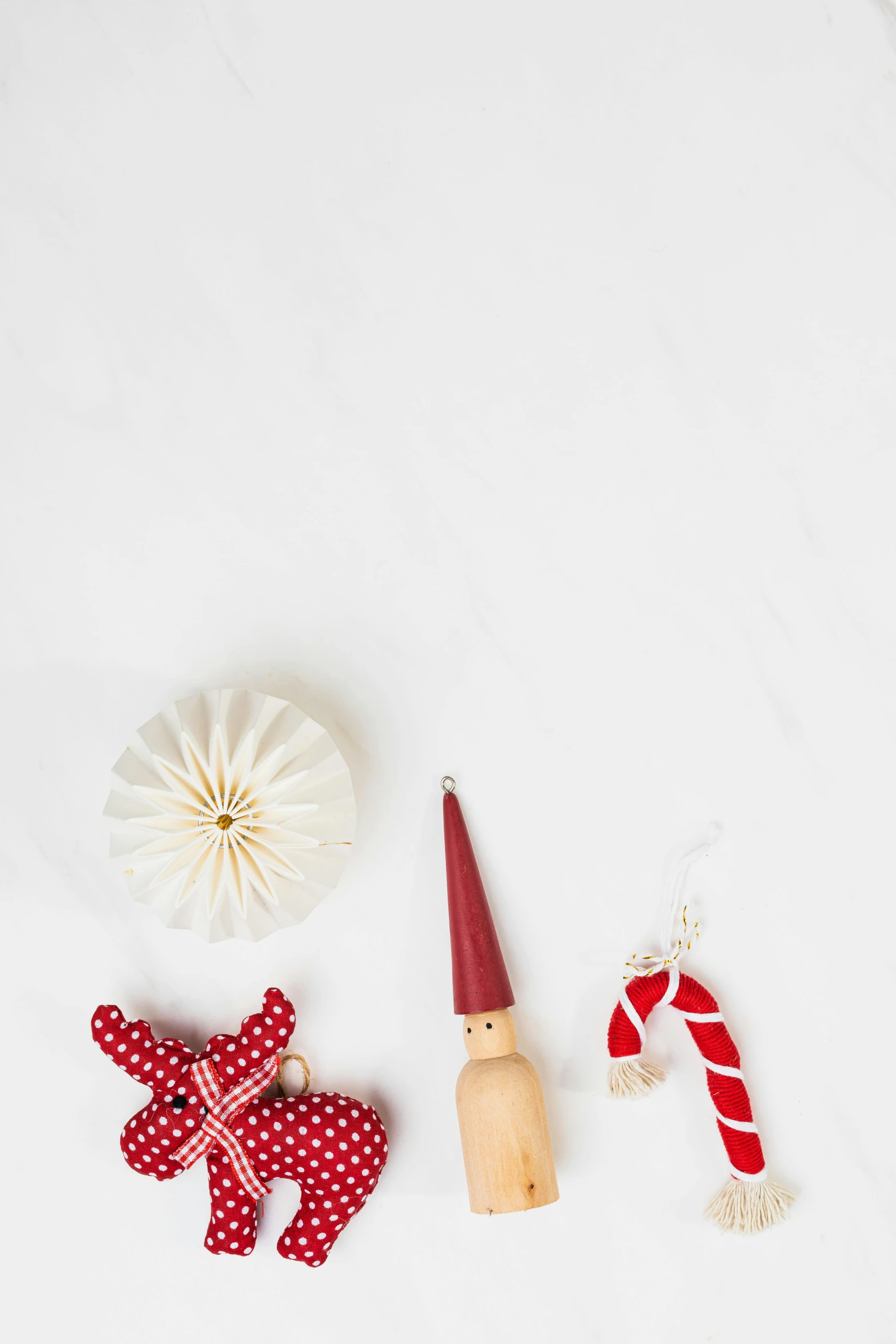 christmas decorations laid out on a white surface, by Andries Stock, trending on pexels, folk art, with small object details, red and white, product introduction photo, scandinavian