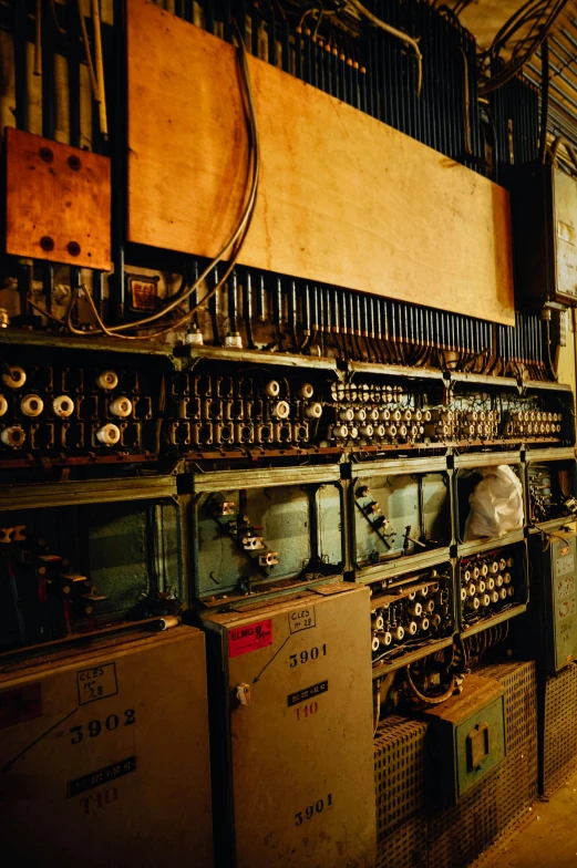 a room filled with lots of old electronic equipment, secret underground lab, softly glowing control panels, 1960s color photograph, deserted shinjuku junk