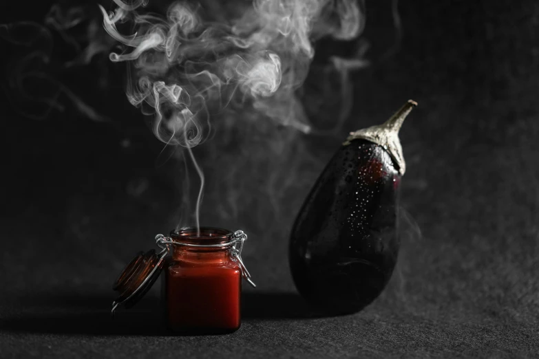 a glass jar filled with smoke next to an eggplant, by Emma Andijewska, pexels contest winner, surrealism, holding hot sauce, hedi slimane, high detailed photography red, gothic atmosphere