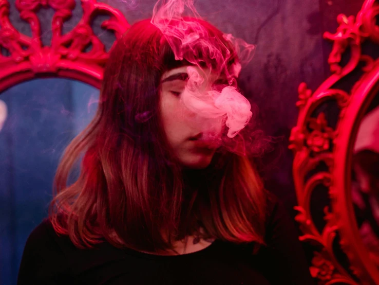 a woman smoking a cigarette in front of a mirror, inspired by Elsa Bleda, pexels contest winner, process art, pink smoke, ganja, bubble goth, lit from below with red lighting