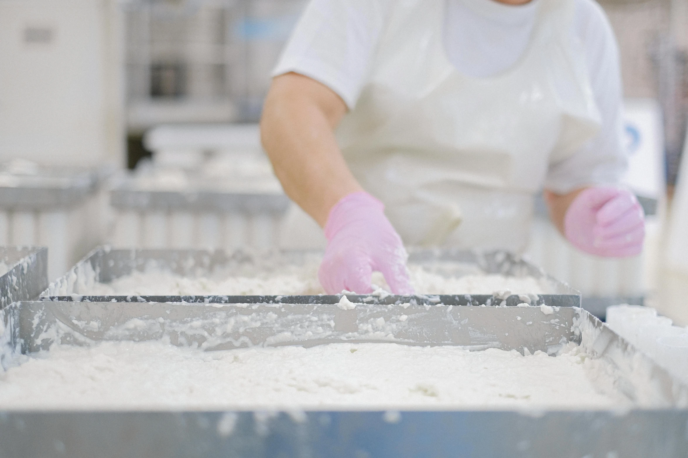 a person in a white shirt and pink gloves, a silk screen, plenty mozzarella, production still, smooth marble surfaces, thumbnail