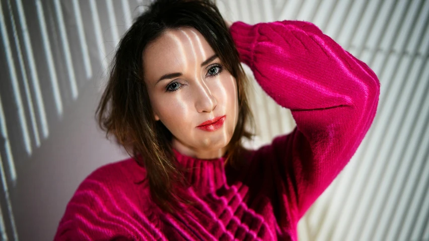 a woman in a pink sweater posing for a picture, a portrait, inspired by Zoë Mozert, pexels contest winner, bright fuchsia skin, bisexual lighting, unblur, anna nikonova aka newmilky