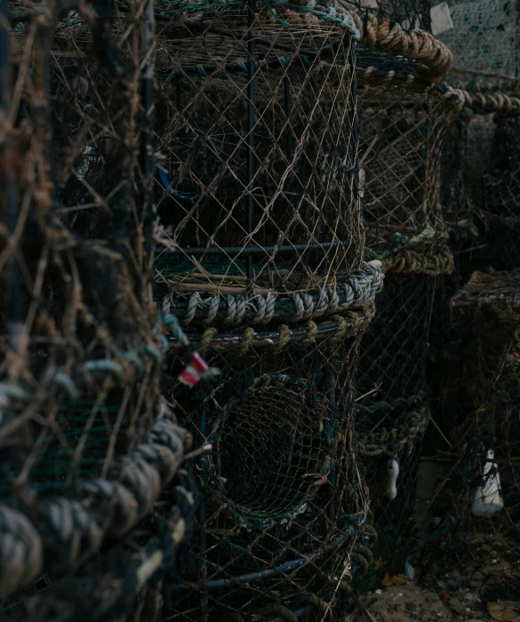 a bunch of lobster cages stacked on top of each other, by Thomas Furlong, unsplash, multiple stories, low quality photo, elliot alderson, olivia kemp