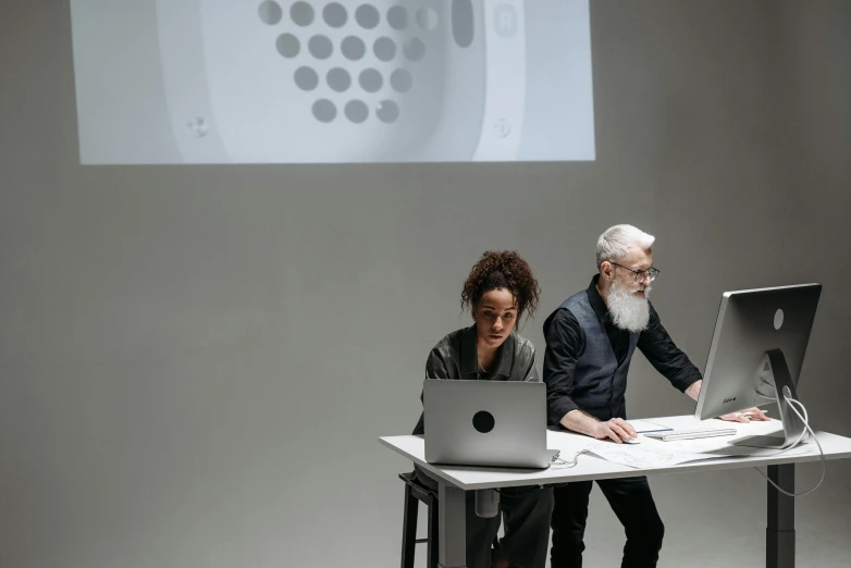 a couple of people sitting at a table with laptops, a computer rendering, by Emma Andijewska, james turrell, table with microphones, teaching, in a white room