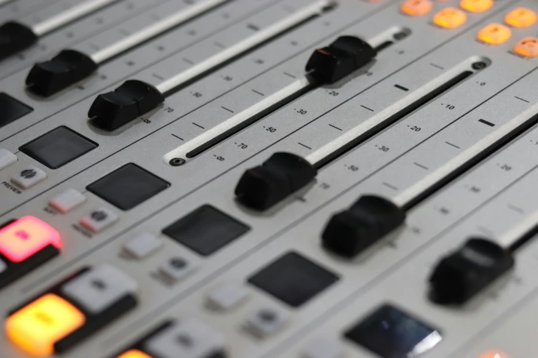 a close up of a sound board in a recording studio, a digital rendering, flickr, bauhaus, gradient white to silver, studio orange, shot on nikon z9, everyone having fun
