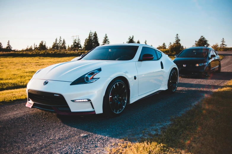 a white sports car parked on the side of a road, pexels contest winner, front and side views, avatar image, [ 4 k photorealism ], cute photo
