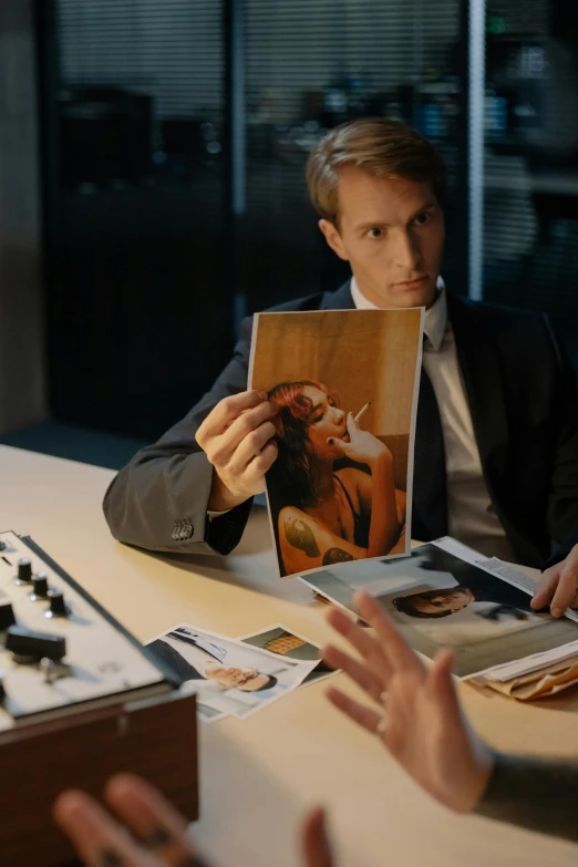 a man sitting at a table reading a book, a photorealistic painting, pexels contest winner, photorealism, in american psycho, 2 0 2 1 cinematic 4 k framegrab, twoface, mark brooks and brad kunkle