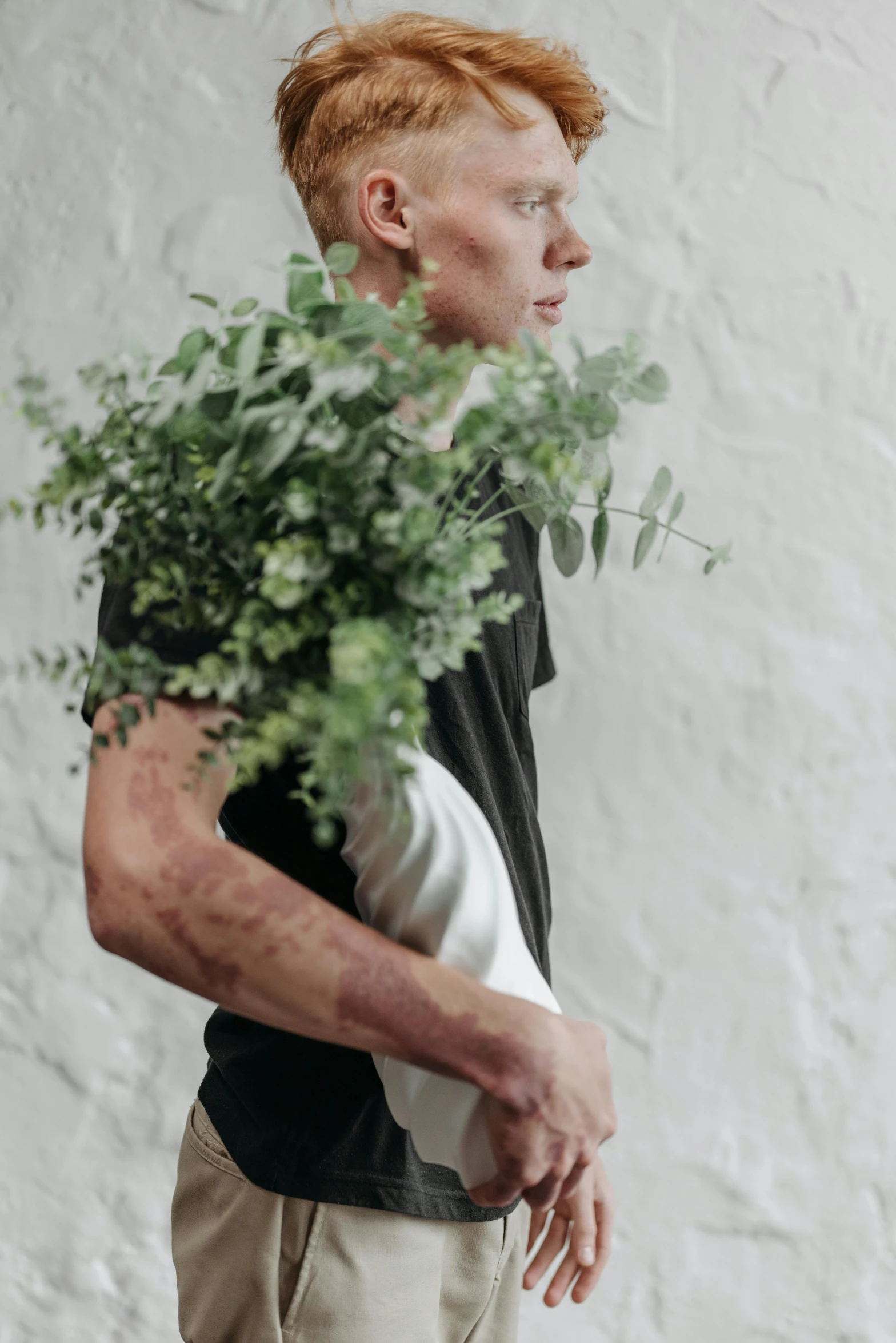 a man with red hair holding a potted plant, trending on unsplash, hyperrealism, covered in bandages, full body hero, profile image, vegetable foliage