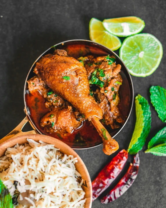 a bowl filled with rice and meat next to a bowl of rice, by Julia Pishtar, pexels contest winner, provocative indian, chicken, herbs, 15081959 21121991 01012000 4k