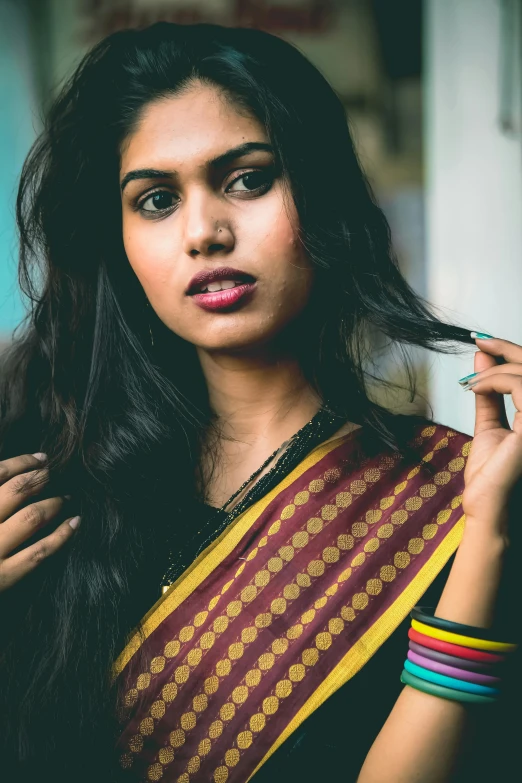 a close up of a woman brushing her hair, an album cover, by Max Dauthendey, pexels contest winner, hurufiyya, dressed in a sari, teen, ((portrait)), 256435456k film
