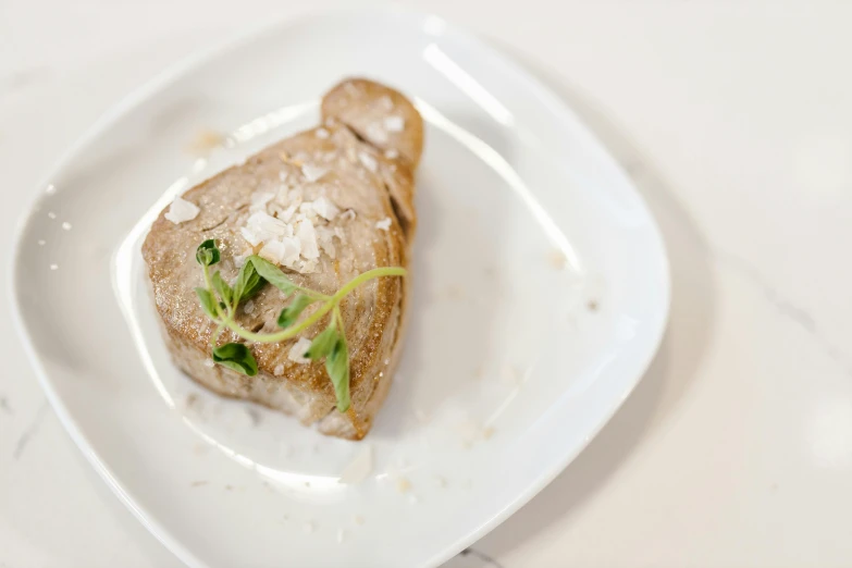 a close up of a plate of food on a table, exposed bone, profile image, fan favorite, soaked