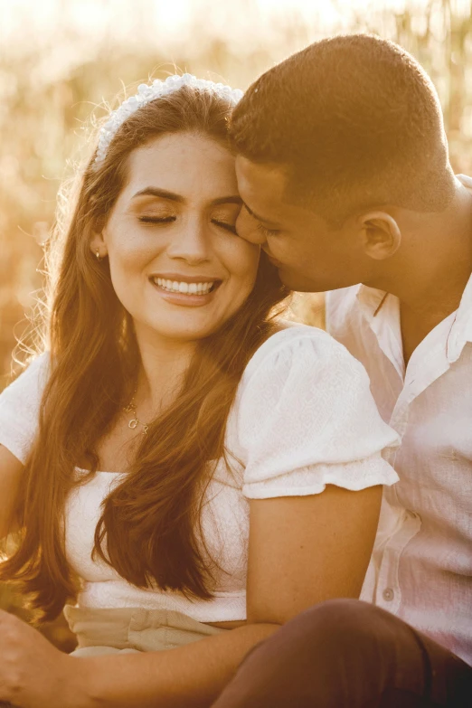 a man and woman sitting next to each other in a field, pexels contest winner, renaissance, kissing smile, stunning sunny lighting, hispanic, headshot