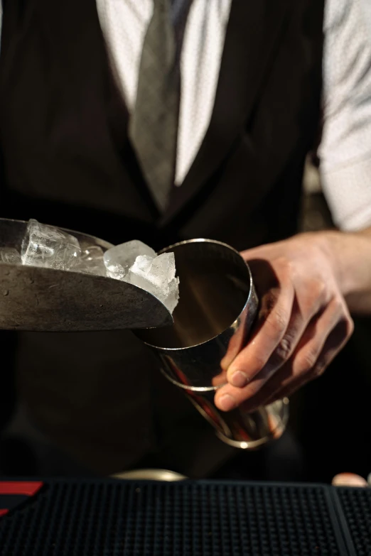 a bartender pouring a drink at a bar, unsplash, renaissance, silver，ivory, holding axe, everything is made out of ice, award - winning crisp details ”