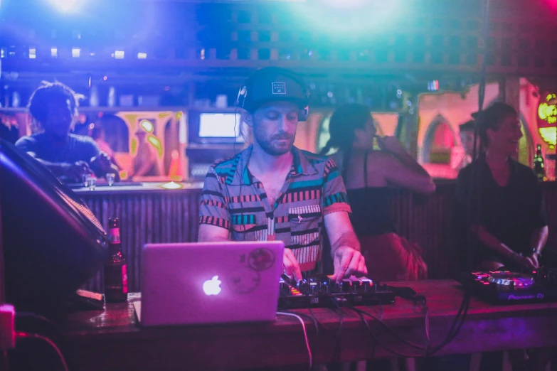 a man that is sitting in front of a laptop, stage at a club, jen bartel, amanda lilleston, profile image