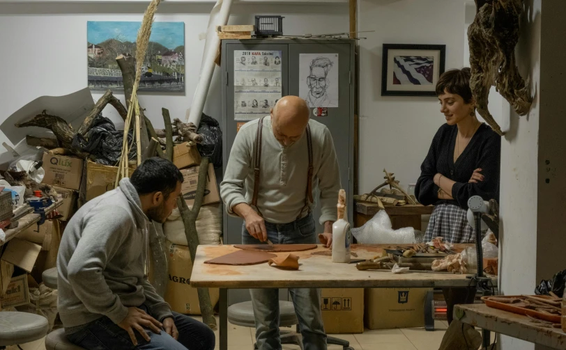 a group of people standing around a table, pexels contest winner, arbeitsrat für kunst, hard clay, profile image, italian, still from the movie