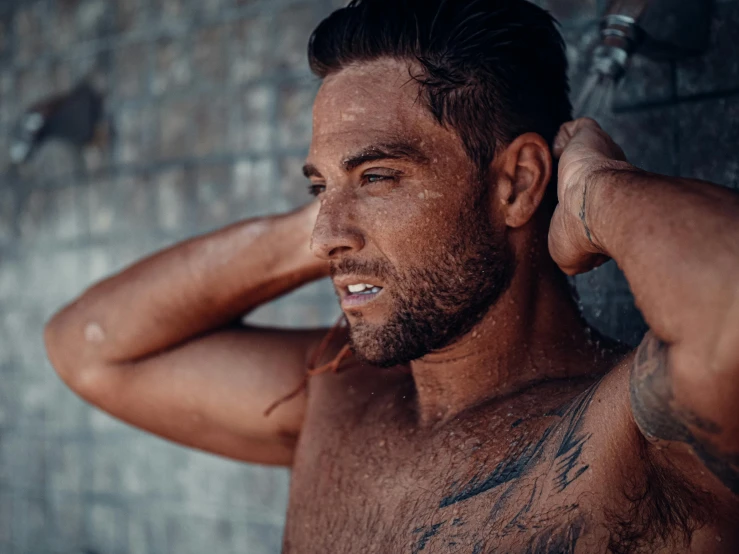 a shirtless man standing in front of a brick wall, by Adam Dario Keel, pexels contest winner, muddy fur, portrait close up of guy, joseph moncada, on a hot australian day