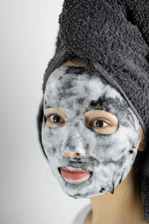a woman with a towel wrapped around her head, reddit, happening, charcoal smudges, close-up product photo, one single mask, silicone skin
