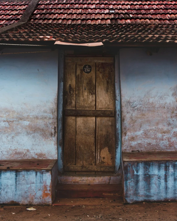 a blue house with a red roof and a wooden door, an album cover, pexels contest winner, renaissance, kerala village, tiny room with dirty wall tiles, thumbnail, brown