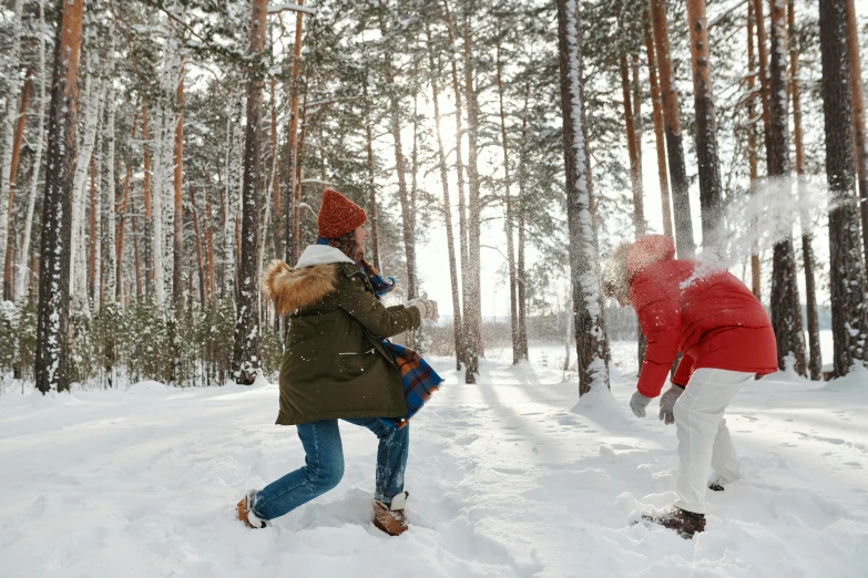 two people are playing in the snow in the woods, pexels contest winner, casual game, thumbnail, 8 k -, profile image