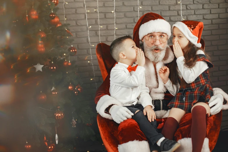 a man sitting in a chair with two small children, a photo, pexels, santa, avatar image, bushy white beard, ƒ/5.0