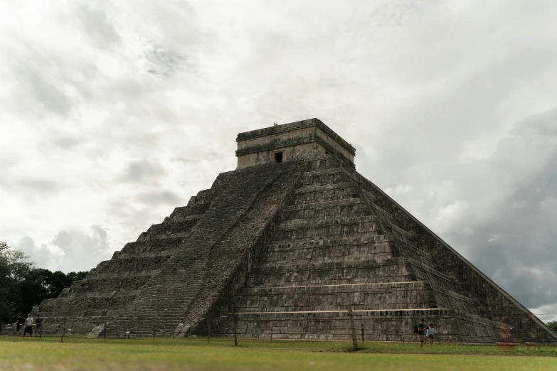 a large pyramid sitting on top of a lush green field, monumental structures, profile image, fan favorite, mayan