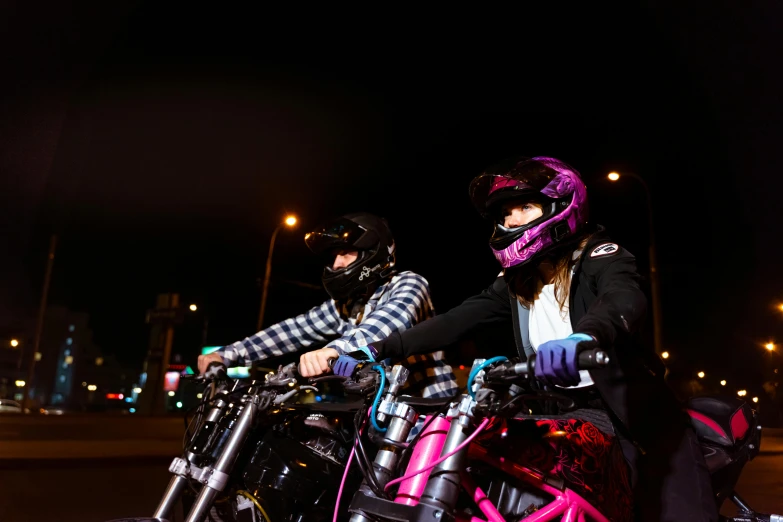 a couple of people that are on some bikes, unsplash, realism, purple and pink and blue neons, 2 techwear women, harley davidson, taken in the late 2010s