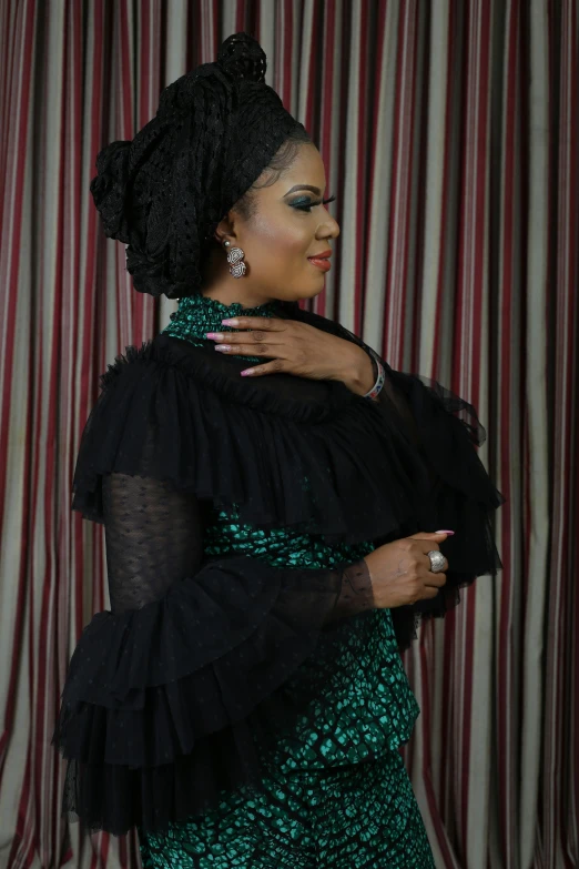 a woman in a green dress posing for a picture, by Chinwe Chukwuogo-Roy, happening, dressed in a frilly ((lace)), in a black chiffon layered robe, nuri iyem, glittering and soft