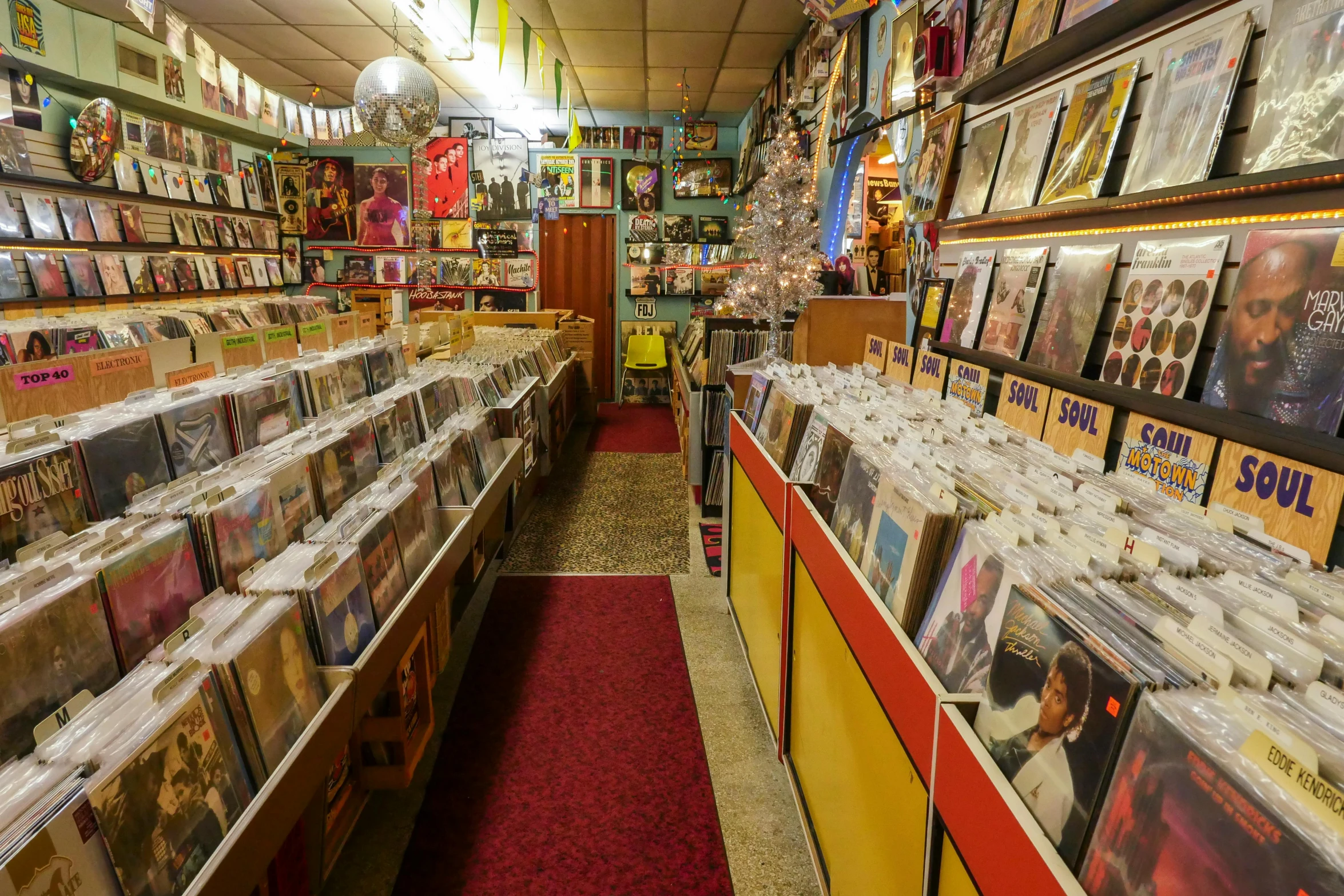 a store filled with lots of cds and cds, an album cover, pexels, underground comix, cavernous interior wide shot, yellow, old pawn shop, thumbnail