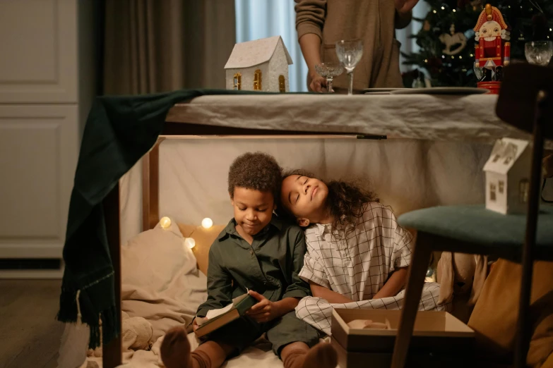 a couple of kids sitting on top of a bed, pexels contest winner, renaissance, holiday season, books cave, mini model, uncropped