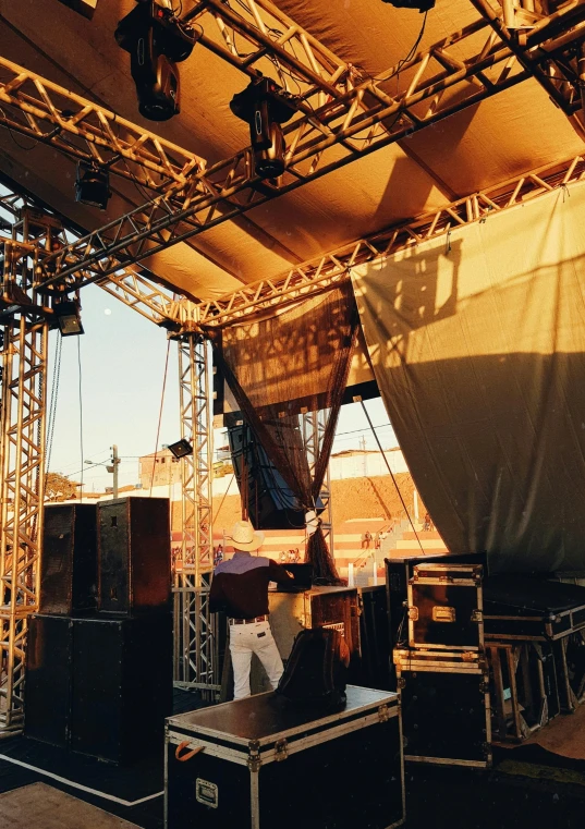 a stage that has a lot of lights on it, full morning sun, 1990s photograph, canopies, system unit