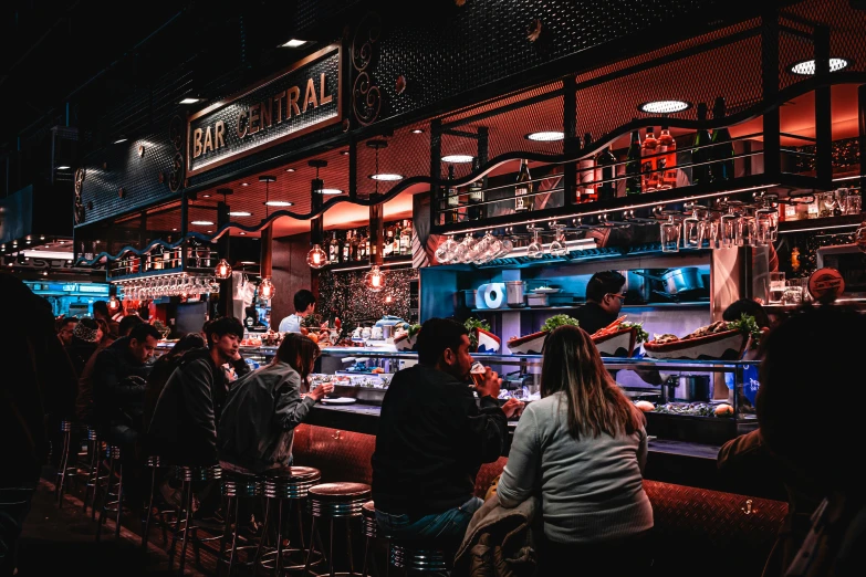 a group of people sitting at a bar, by Julia Pishtar, pexels contest winner, central pork, madrid, terminals, thumbnail