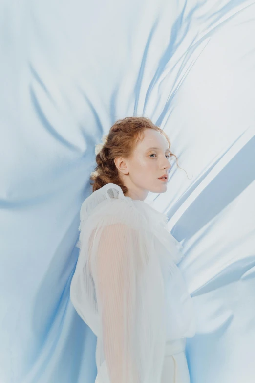 a woman in a white dress and veil, an album cover, inspired by Anna Füssli, renaissance, pale blue, sansa, promo photo, flowing shimmering fabrics