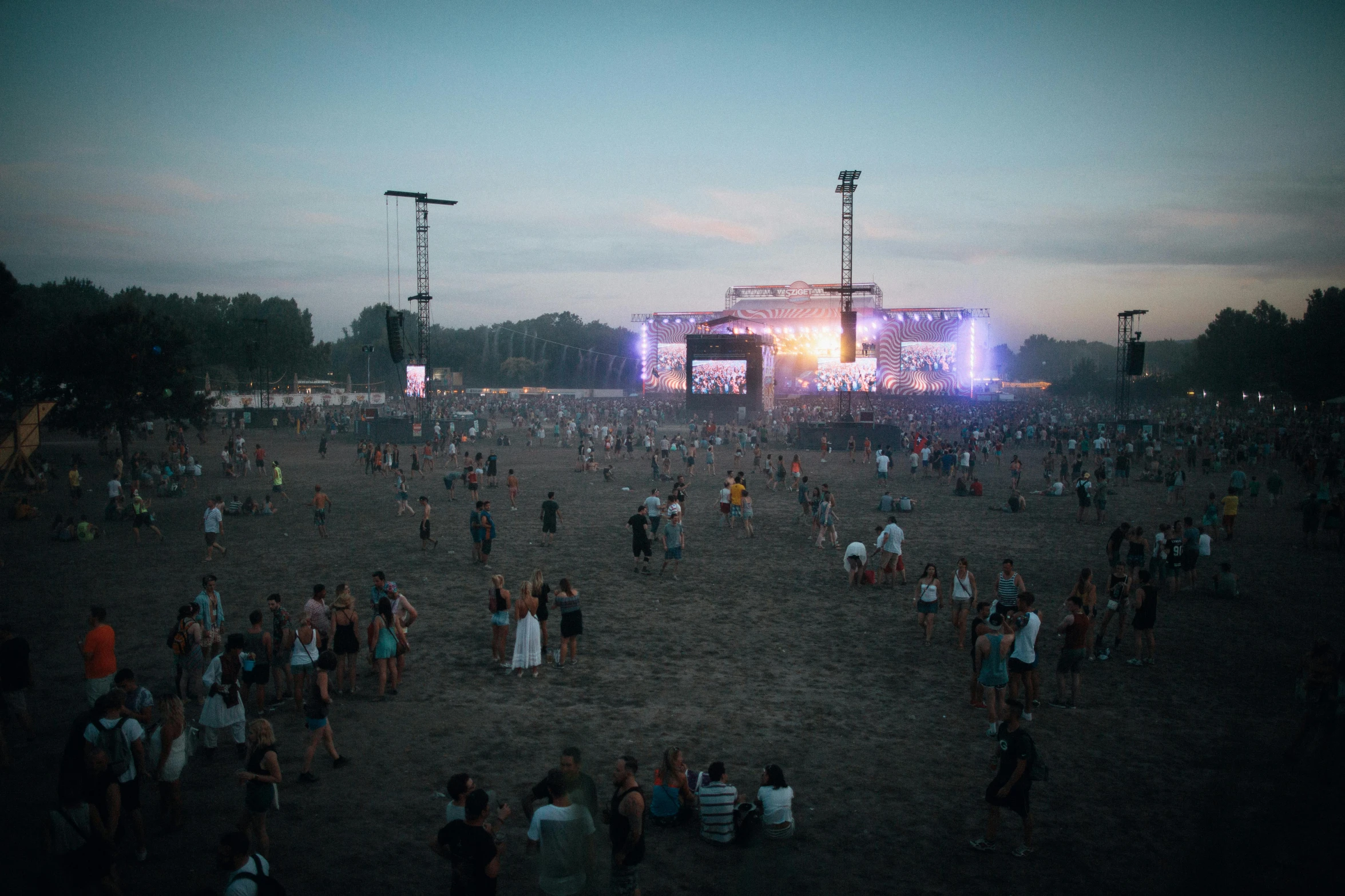 a large group of people standing on top of a field, a person at a music festival, warsaw, 2022 photograph, high lights