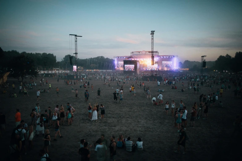 a large group of people standing on top of a field, a person at a music festival, warsaw, 2022 photograph, high lights