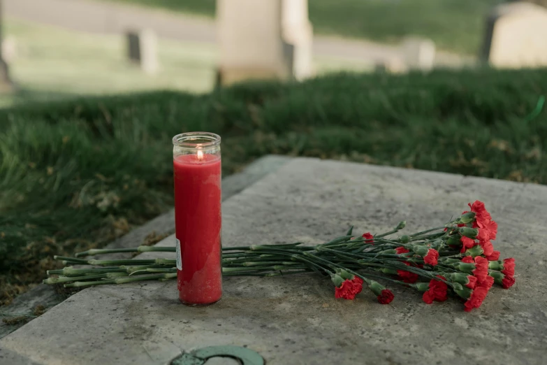 a red candle sitting on top of a cement slab, dead soldiers, profile image, cemetery, high quality product image”