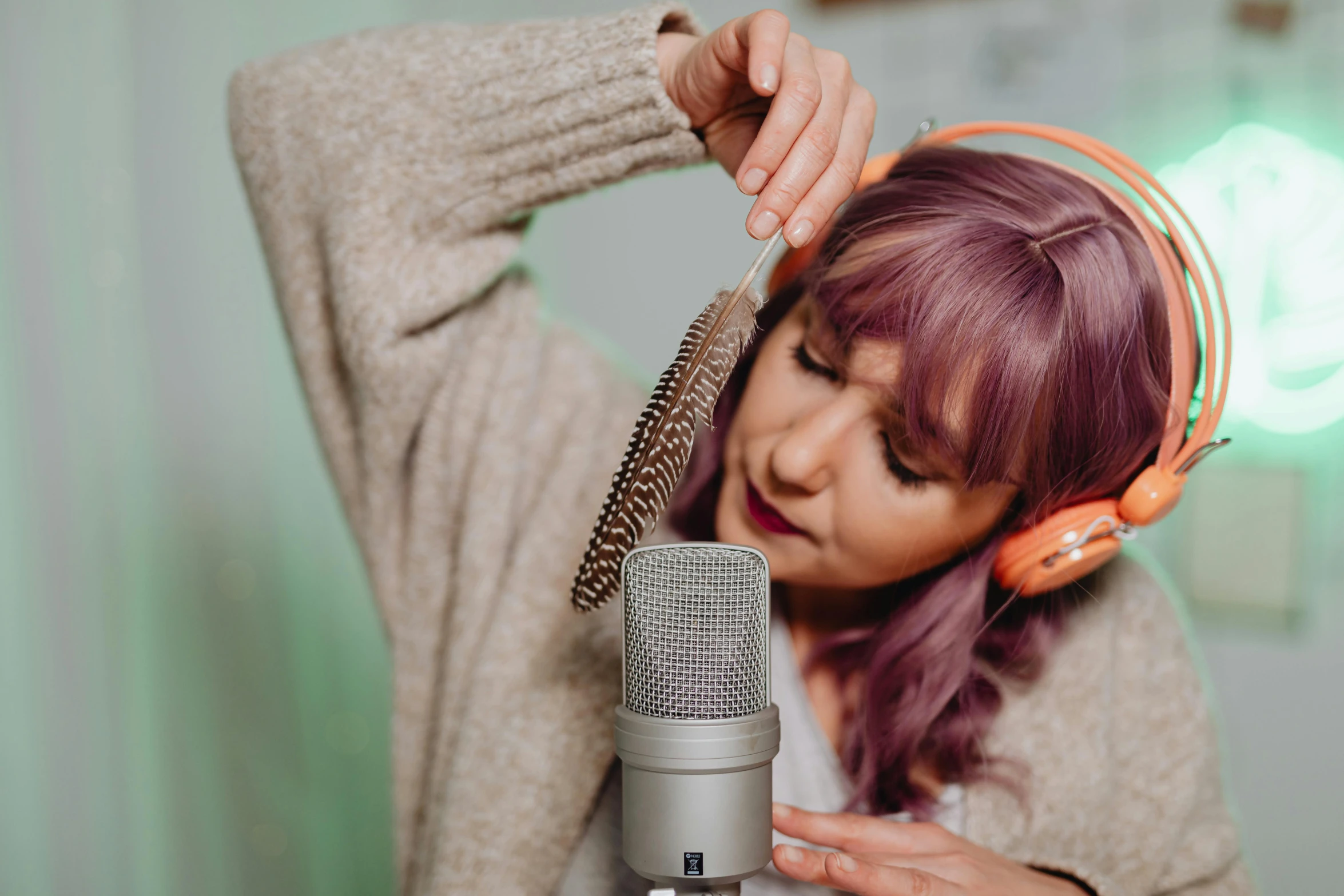 a woman with headphones sitting in front of a microphone, trending on pexels, art nouveau, furry artist, studio microphone, product introduction photo, bedhead