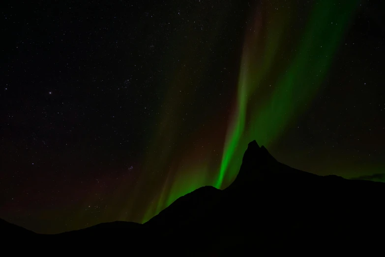 the aurora lights up the night sky over a mountain, by Hallsteinn Sigurðsson, pexels contest winner, hurufiyya, bright green dark orange, on black background, grey, seen from below