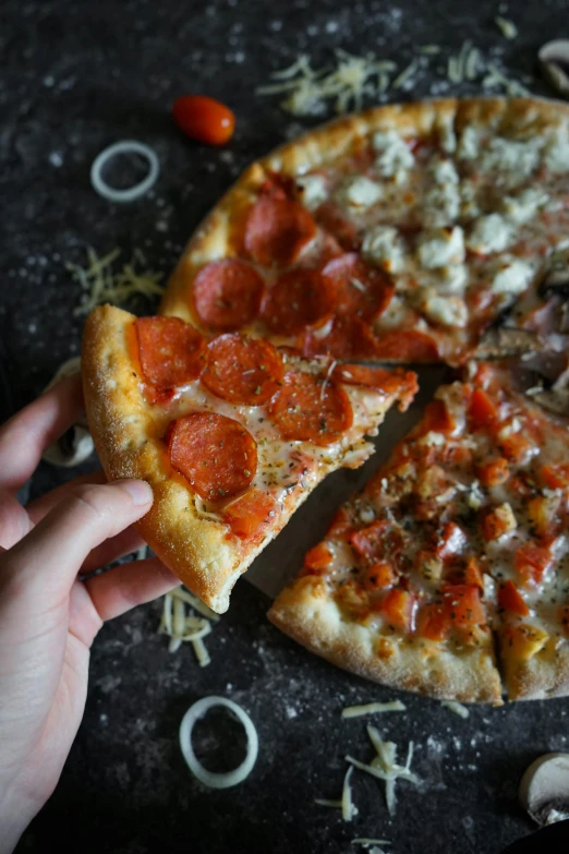 a close up of a person holding a slice of pizza, different sizes, crackles, fan favorite, petite