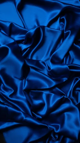 a close up of a blue satin fabric, inspired by Yves Klein, pexels, blue lights, instagram post, multicoloured, wavy