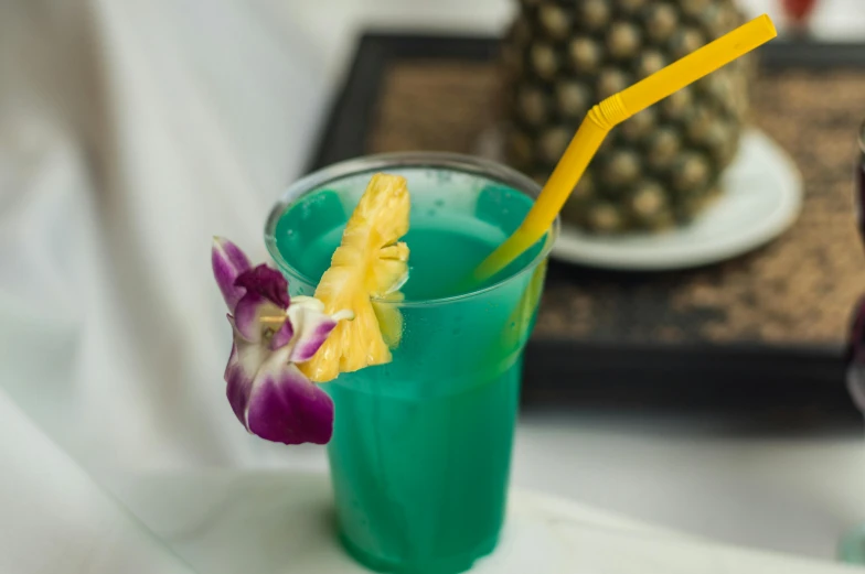 a blue drink with a pineapple garnish garnish garnish garnish garnish garnish garnish, a portrait, by Nicolette Macnamara, unsplash, square, jade green, plumeria, full body close-up shot