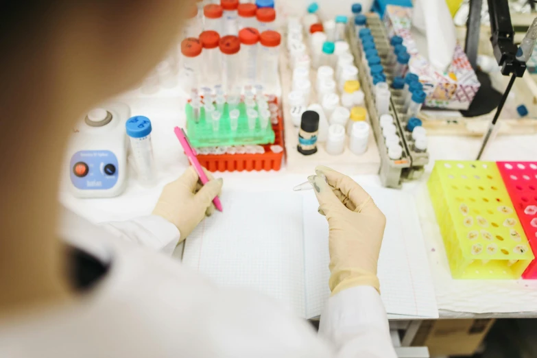 a close up of a person working in a lab, pexels, sterile colours, charts, a wide shot, unedited