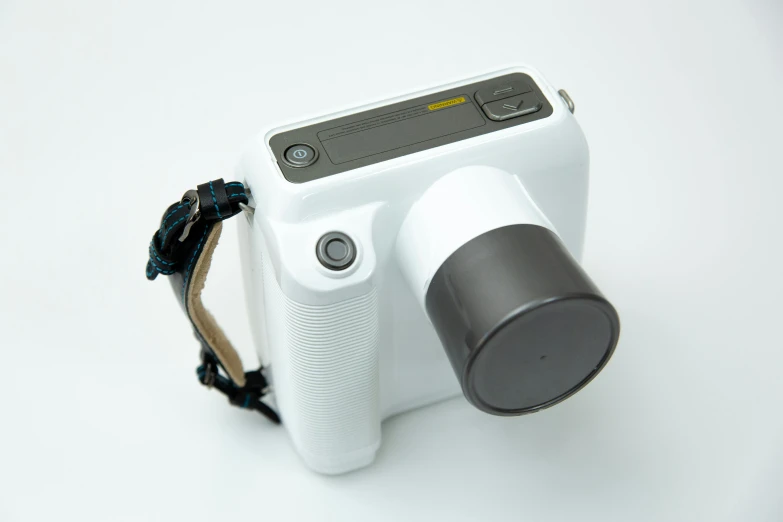 a white camera sitting on top of a white table, a polaroid photo, hurufiyya, fully frontal view, handheld, 3 d print, detailed product image