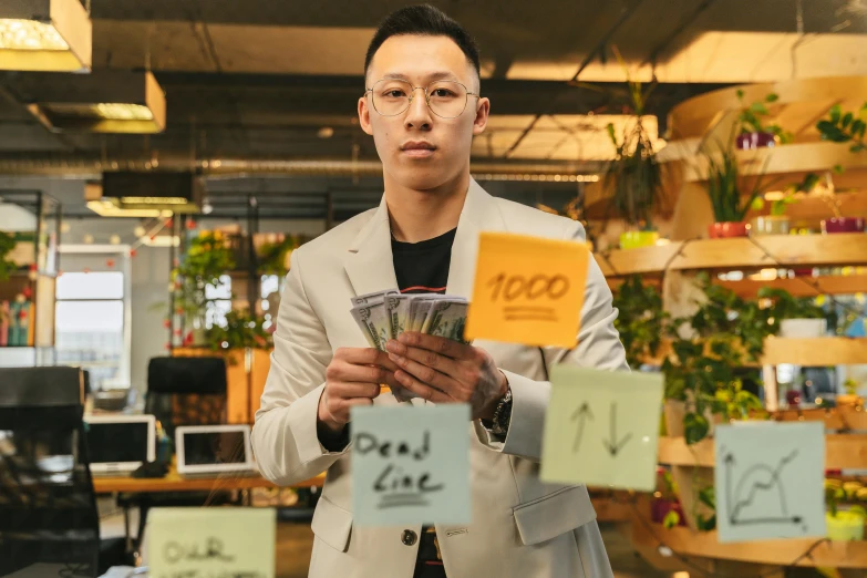 a man in a suit holding a bunch of money, by Julia Pishtar, pexels contest winner, maximalism, jin shan and ross tran, working in an office, nvidia promotional image, three quater notes