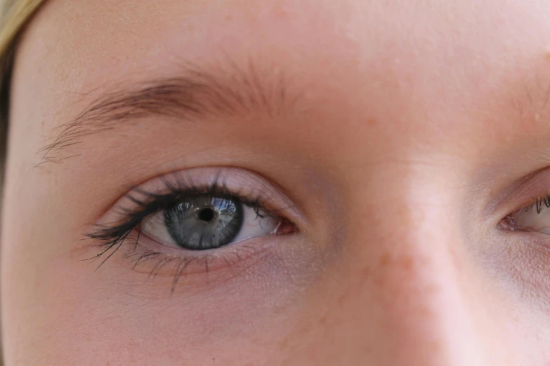 a close up of a person with blue eyes