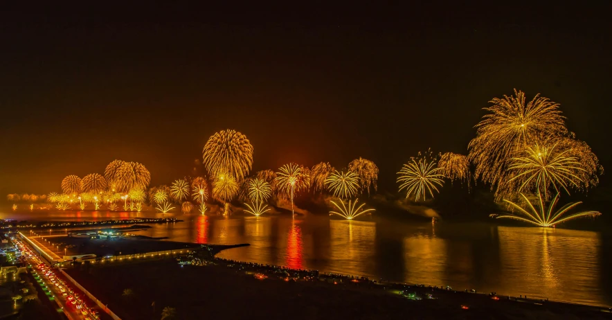 fireworks light up the sky over a body of water, pexels contest winner, hurufiyya, oman, smokey lights, thumbnail, 8 k -