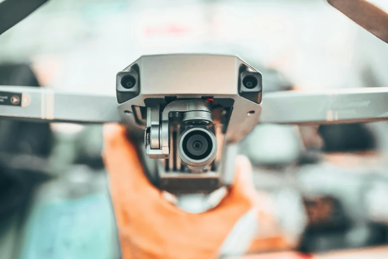 a close up of a person holding a camera, uav, mechanics, avatar image, angled shot